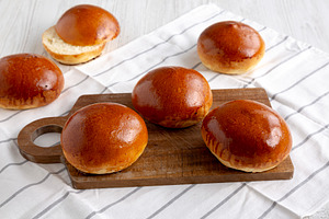 Homemade Brioche Buns Ready to Eat, side view., a Food & Drink Photo by LiudmylaChuhunova