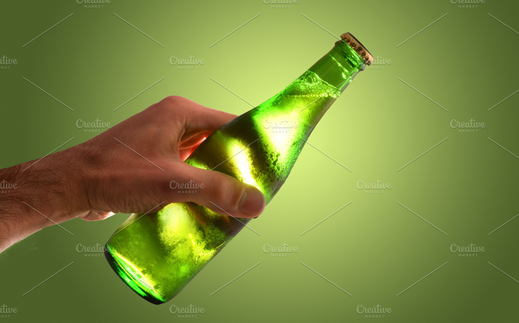 Cold Beer Bottle in Hand, a Food & Drink Photo by Davizro's Market