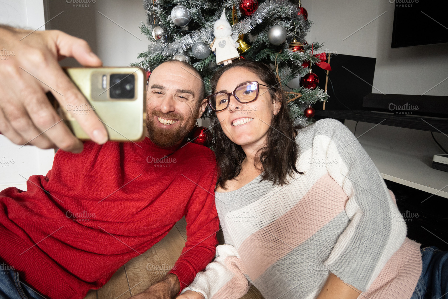 Couple Taking a Selfie with Their Christmas Tree, a Person Photo by etorres69