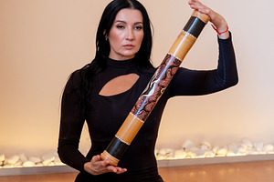 Yoga practice sound healing woman ethnic rainstick, a Person Photo by Photo Drive Studio