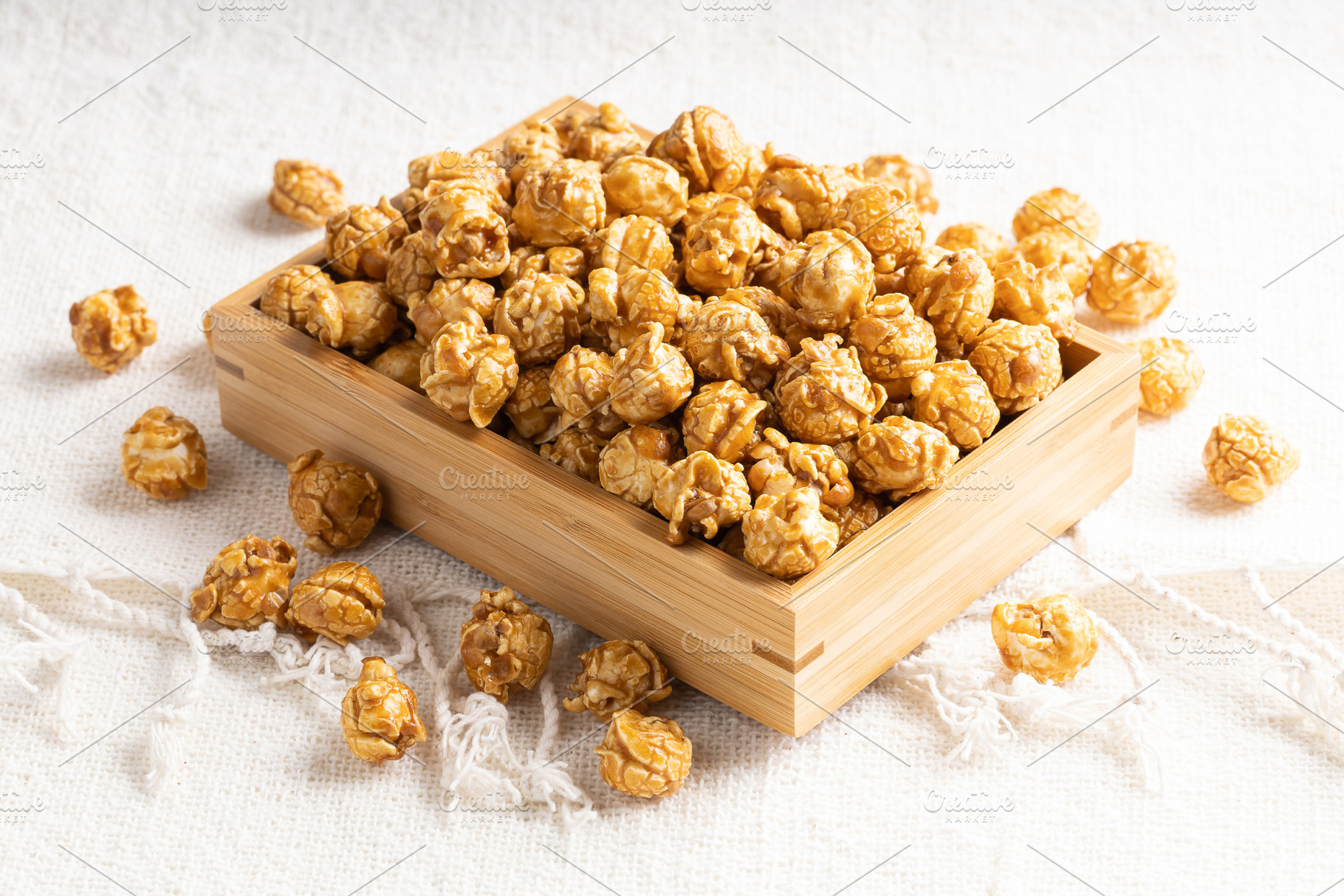 Caramel popcorn in bamboo wooden box, a Food & Drink Photo by Smith Chetanachan