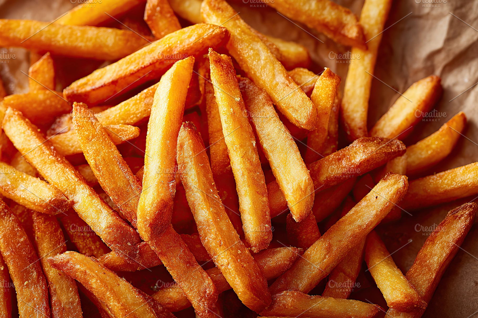 Freshly cooked golden french fries served on a crispy paper background for appe, a Food & Drink Photo by AlyaAnd