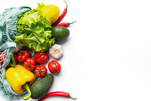 Fresh produce in string bag for healthy eating, a Food & Drink Photo by Olena Rudo