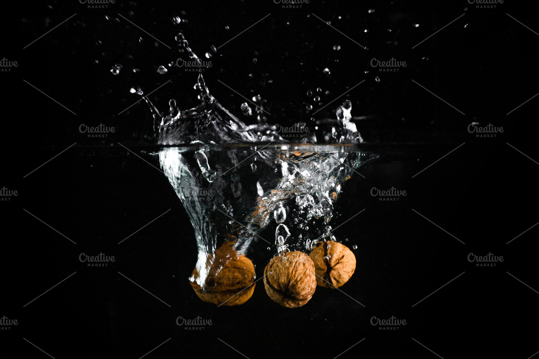 Nuts in water stock photo containing water and black