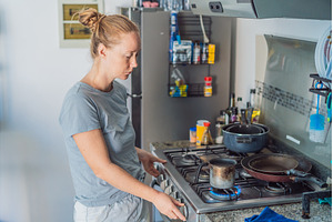Woman preparing breakfast in a, a Food & Drink Photo by Elizaveta Galitskaya