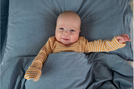 newborn baby boy in the bed, the, a Person Photo by Koldunova