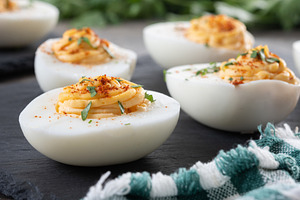 Homemade hard Boiled Deviled Eggs garnished with herbs, a Food & Drink Photo by etorres69