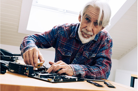 Senior Man Assembling Computer Parts