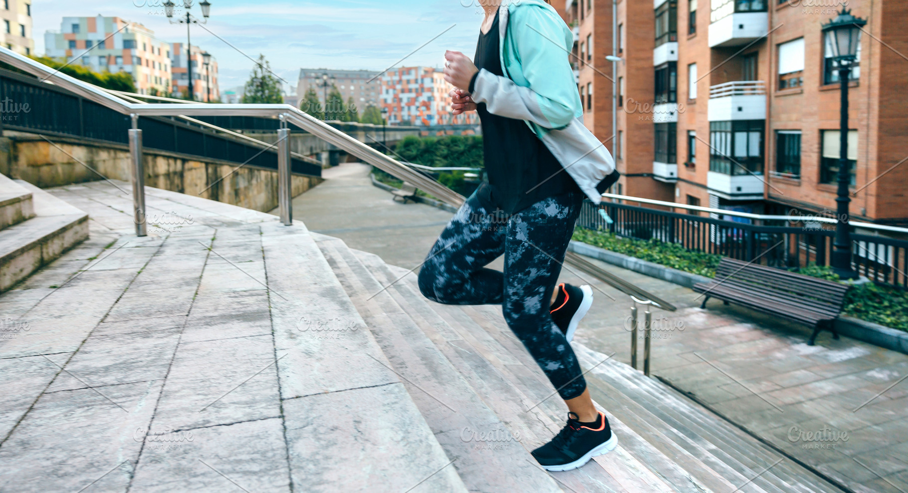 Woman training cardio running up stairs in town, a Sports & Recreation Photo by davidpereiras