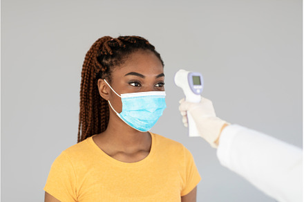 Young black female patient in face, a Person Photo by Prostock-Studio