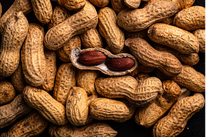 Pile of peanuts with one opened pod, a Food & Drink Photo by Yulia Furman