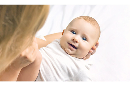 Mother with baby on a light, a Person Photo by yanadjana