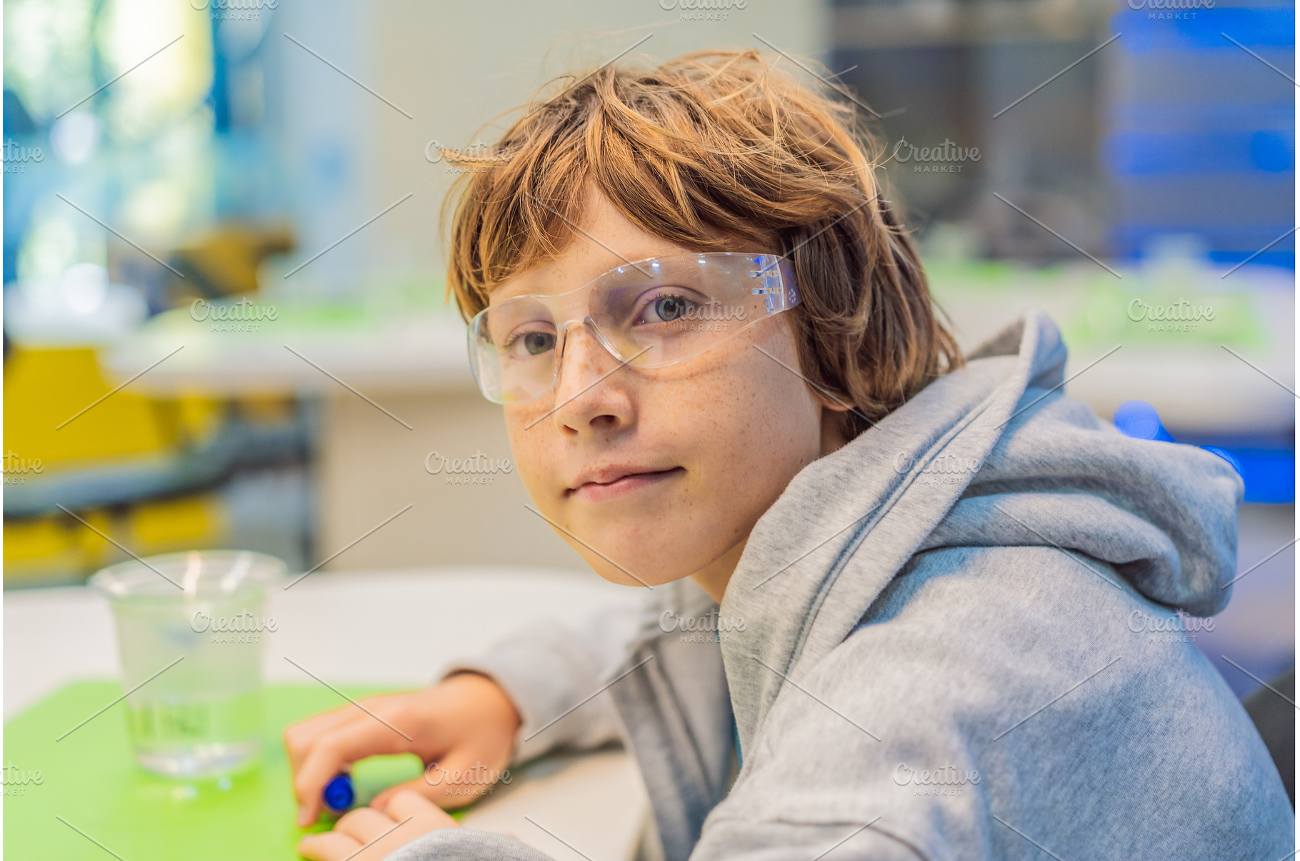 Teenage boy wearing safety glasses, a School & Education Photo by Elizaveta Galitskaya