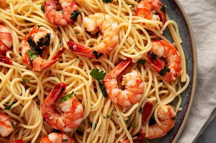 Homemade Cooked Garlic Shrimp Scampi on a Plate, top view. Flat, a Food & Drink Photo by LiudmylaChuhunova