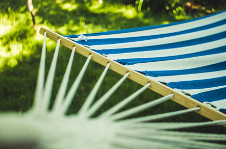 close up empty hammock with blue and white stripes on a simmer day in tropical forest, a Background Photo by Mikee's stuff