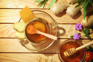 Honey and ginger infusion on wooden table with natural products, a Food & Drink Photo by Davizro's Market