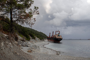 A seascape with a ship stranded, a Transportation Photo by Schreibikus
