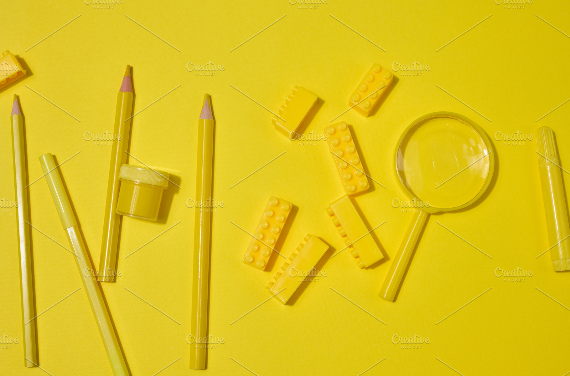 Collection of yellow stationery, building brick, and magnifying, a School & Education Photo by ndanko
