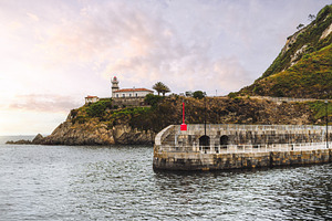 Lighthouse on Cudillero coast, an Architecture Photo by SkyNext
