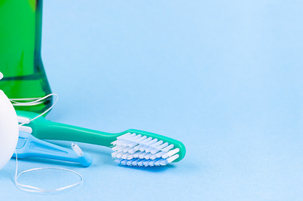 Banner with dental floss, toothbrush and mouthwash on blue background, a Health & Medical Photo by iuliia_n