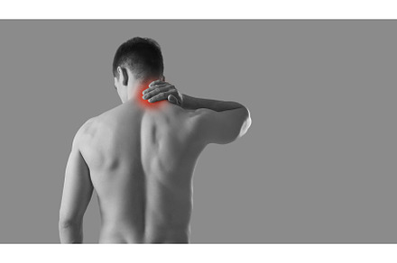 Rear view of man rubbing his sore, a Person Photo by StudioRomantic