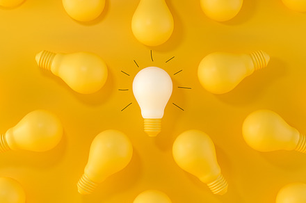 Glowing Light Bulb between the other, a Business Photo by Zama Studio