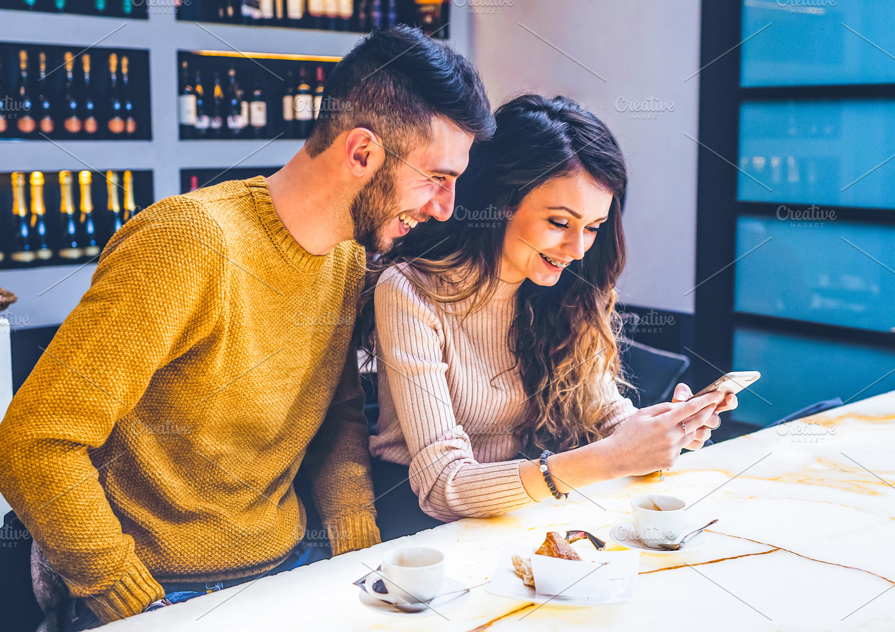 Young Couple Enjoying Coffee and Social Media, a Person Photo by Antonio Gravante Market