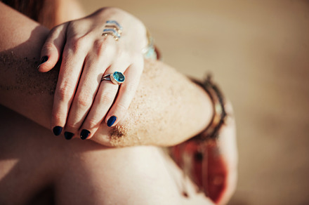 Close up hands with boho accessories containing jewelry, bohemian, and boho