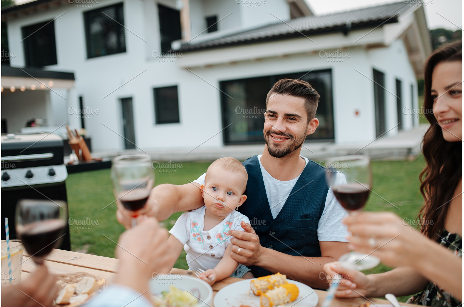 Family toasting with wine during, a Person Photo by HalfPoint