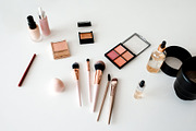 Above-View Of Cosmetic Products And Camera Lenses On White Background, a Photo by Prostock-Studio (Thumbnail 2 of 4)