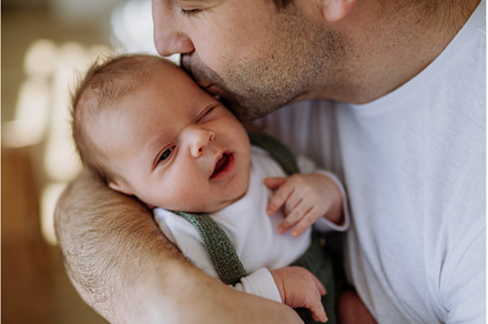 Close-up of father holding and, a Person Photo by HalfPoint