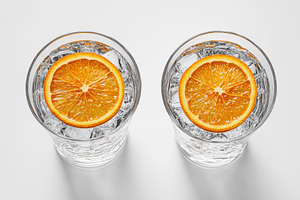 Two glasses of refreshing iced water, a Beauty & Fashion Photo by Pixeness Studio