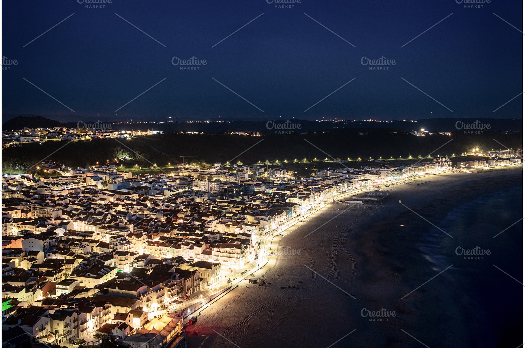 Night time cityscape of Nazare, an Architecture Photo by Nature and travel