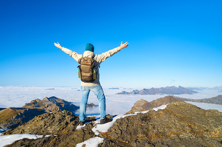 Tourist with a backpack in mountains, a Person Photo by Landscape and travel