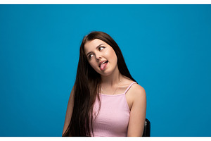 Young woman making a playful silly, a Person Photo by volodymyrshtun13795