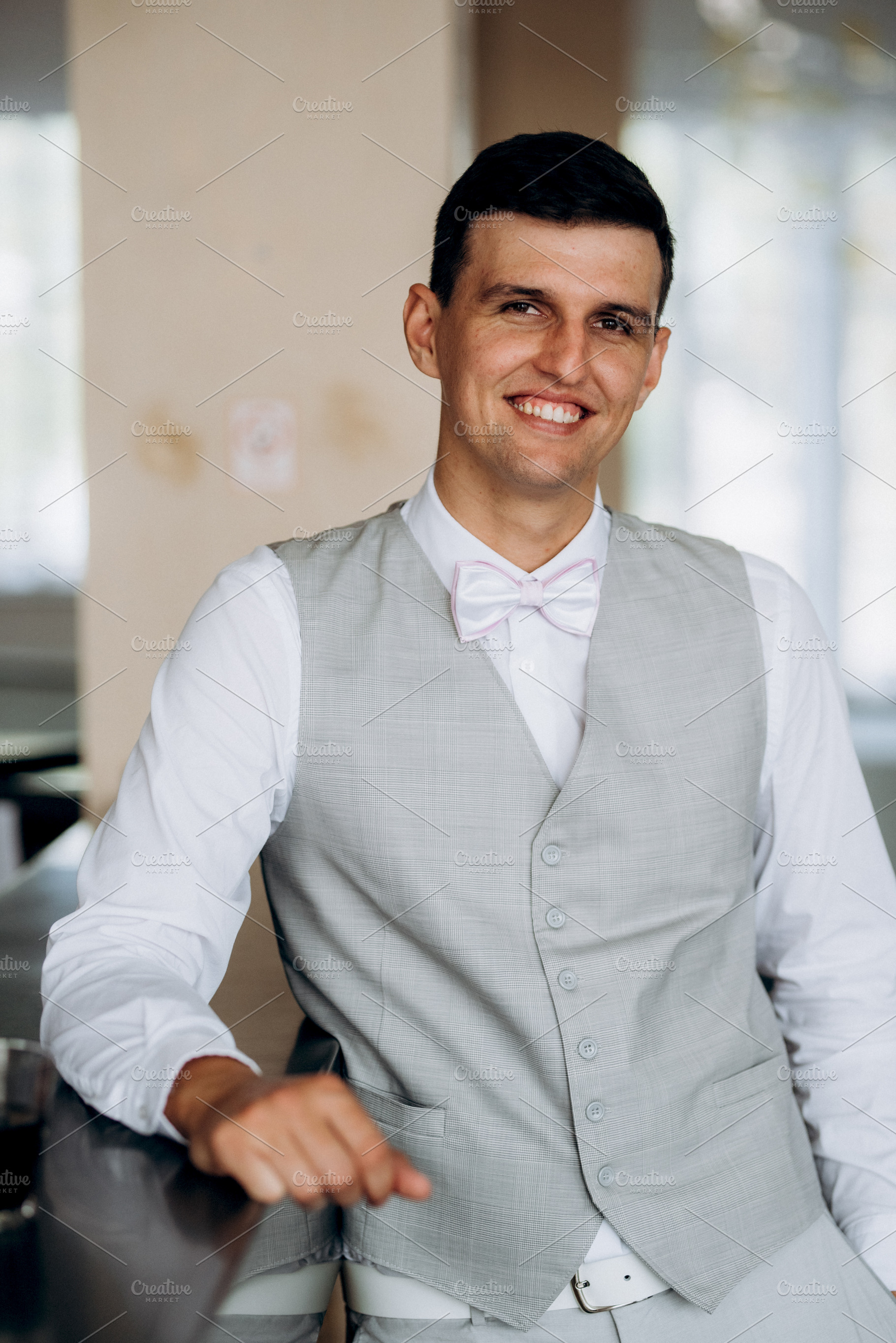 portrait of a groom in a suit and white bow, a Person Photo by Weddings, People, Travel