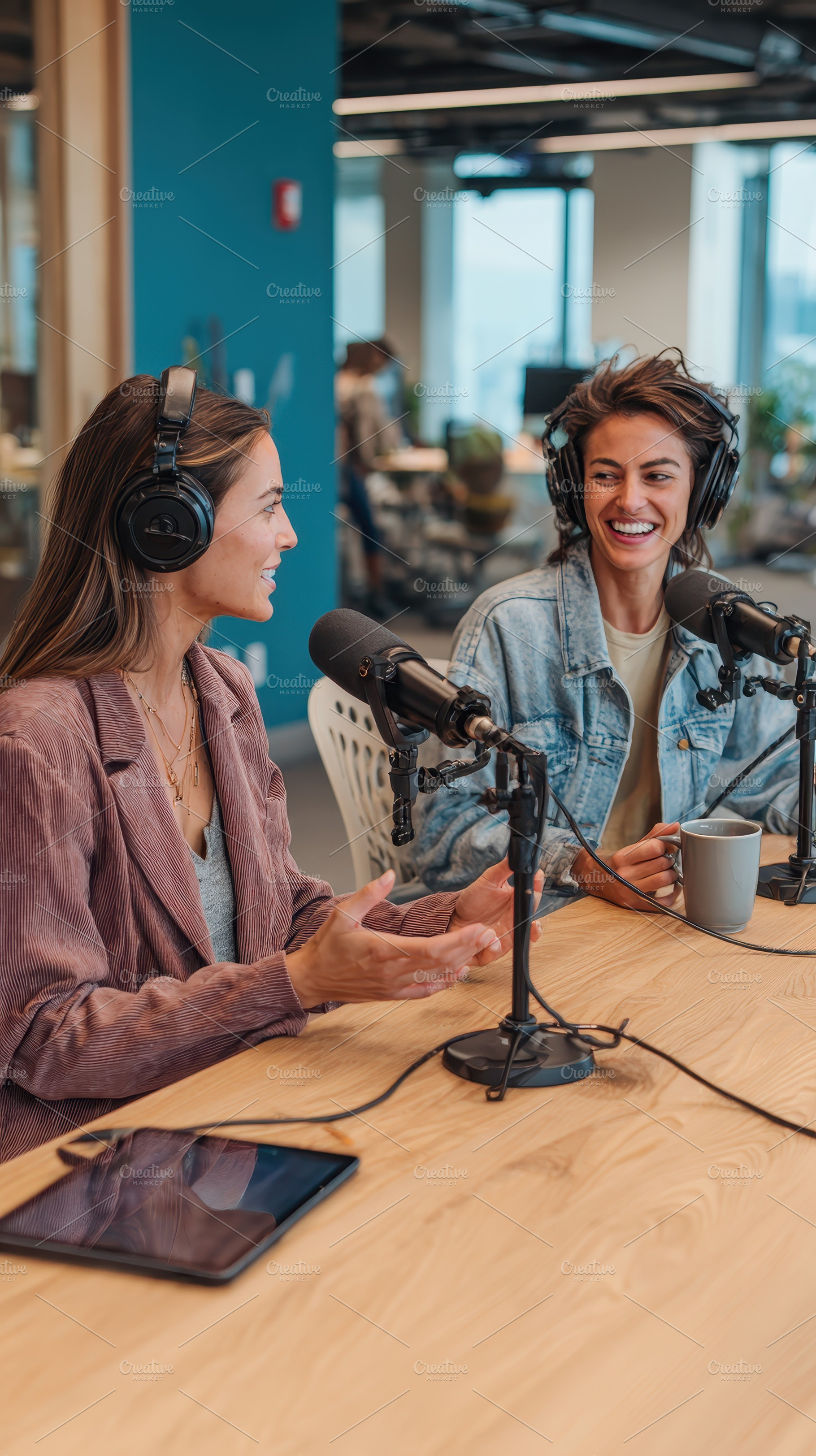Two women podcasting in a modern off, a Photo by Pixeness Studio