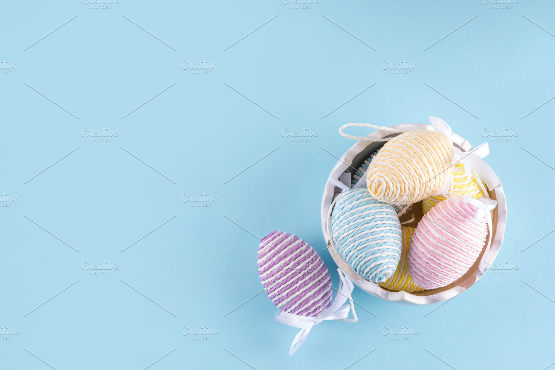 Happy Easter minimal background with pastel colored holiday eggs, a Holiday Photo by Rimma