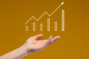 A woman's hand holds a glowing digital graph with an upward tren, a Business Photo by ndanko