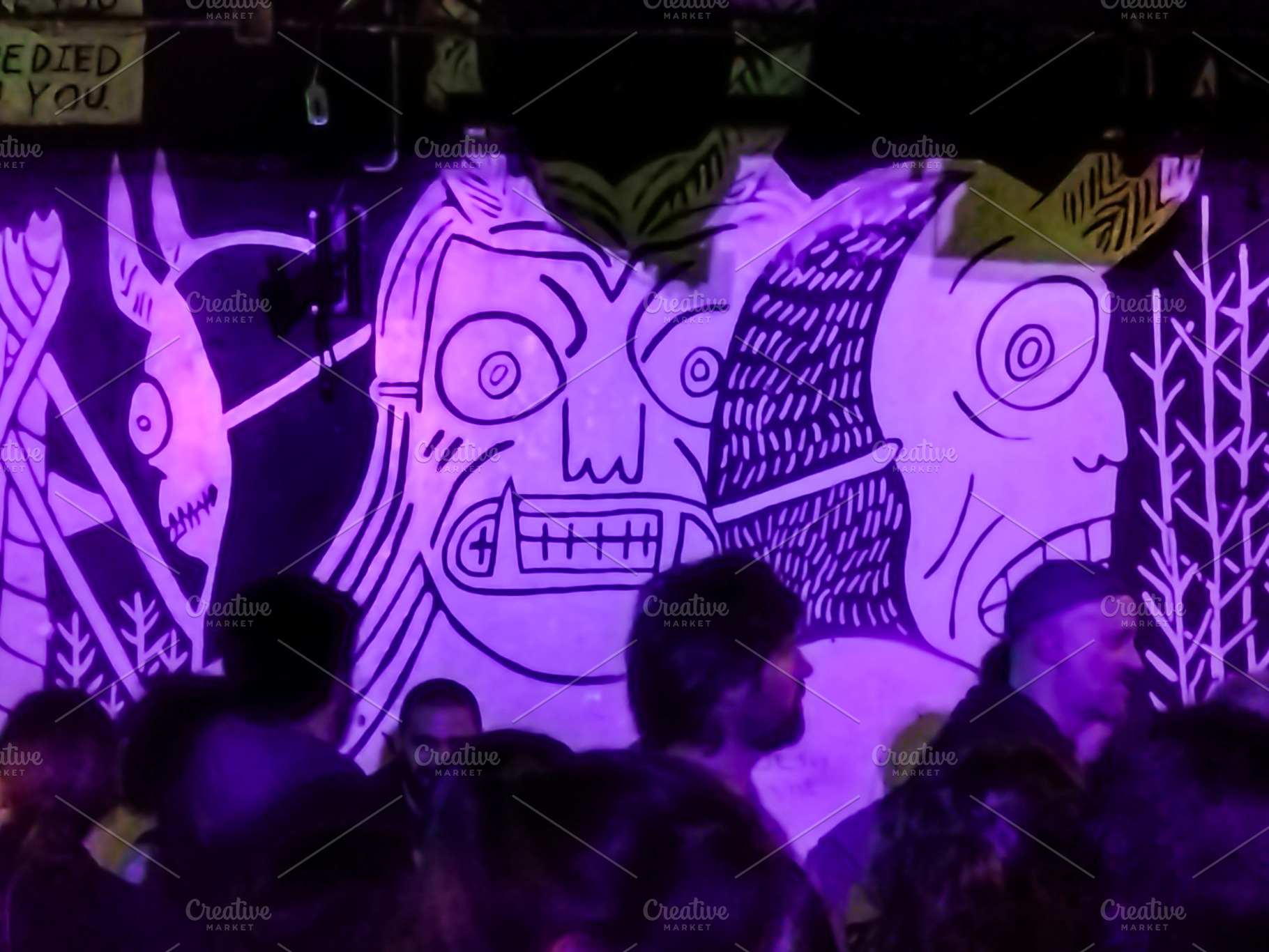 Crowd silhouettes at a live concert with purple stage lights, an Arts & Entertainment Photo by DanFLCreativo