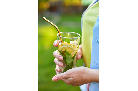 Woman drinking summer citrus, a Food & Drink Photo by IlliaBondarPhotography