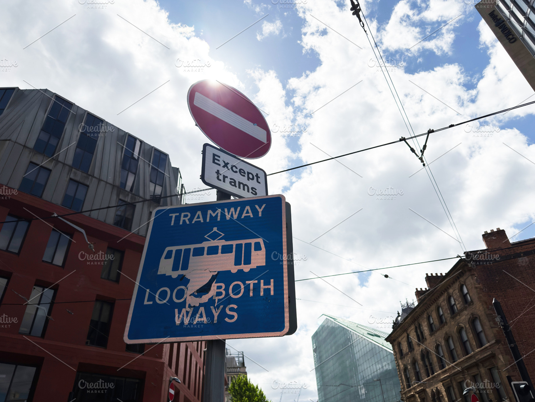 Tramway sign and no entry symbol on a cloudy street in Mancheste, a Photo by AS photostudio