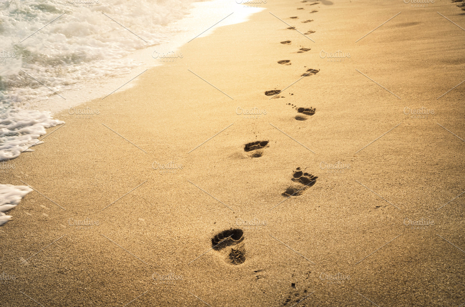 Footprints in the sand stock photo containing footprints and sand, a Nature Photo by hitdelight