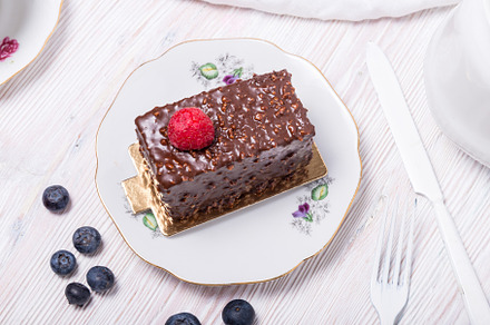 Piece of berry cake decorated with fresh berries on wooden backg, a Food & Drink Photo by MDBildes