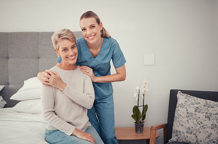 Homecare, senior healthcare and doctor helping a sick woman with care in bedroom of home. Portrait of a medical nurse giving help, support and consulting with elderly person during house consultation, a Photo by Peopleimages.com