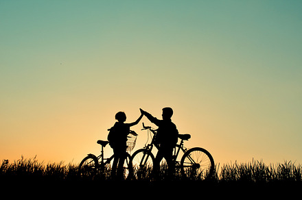 Silhouette of children with bicycle featuring active, background, and, a Holiday Photo by sawitree