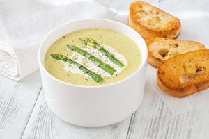 Creamy asparagus soup in white bowl, a Food & Drink Photo by Alexander Prokopenko
