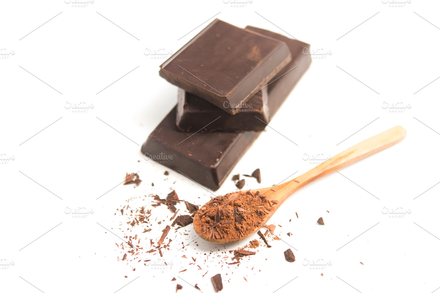 black Chocolate on spoon close up, a Food & Drink Photo by DalaiFood