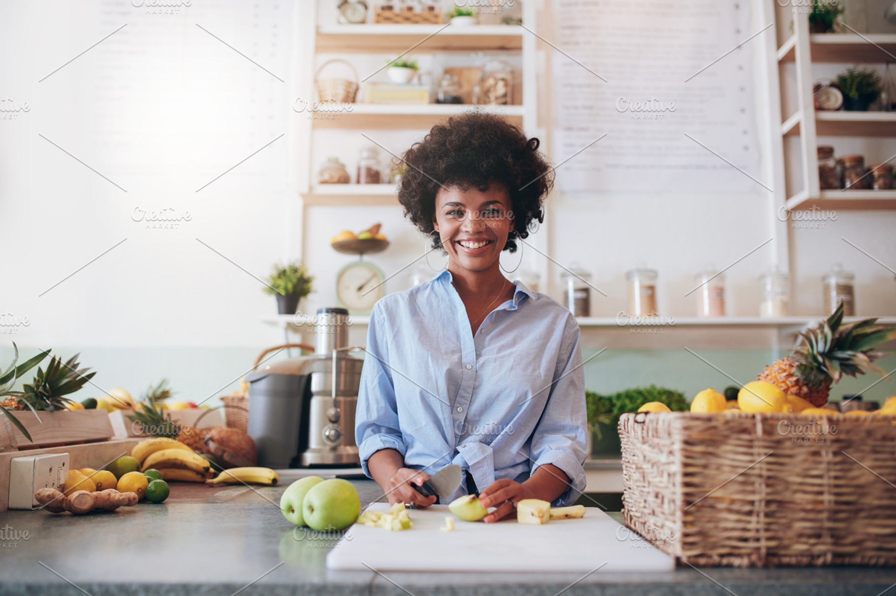 Young african woman working featuring african, apple, and attractive, a Food & Drink Photo by Jacob Lund