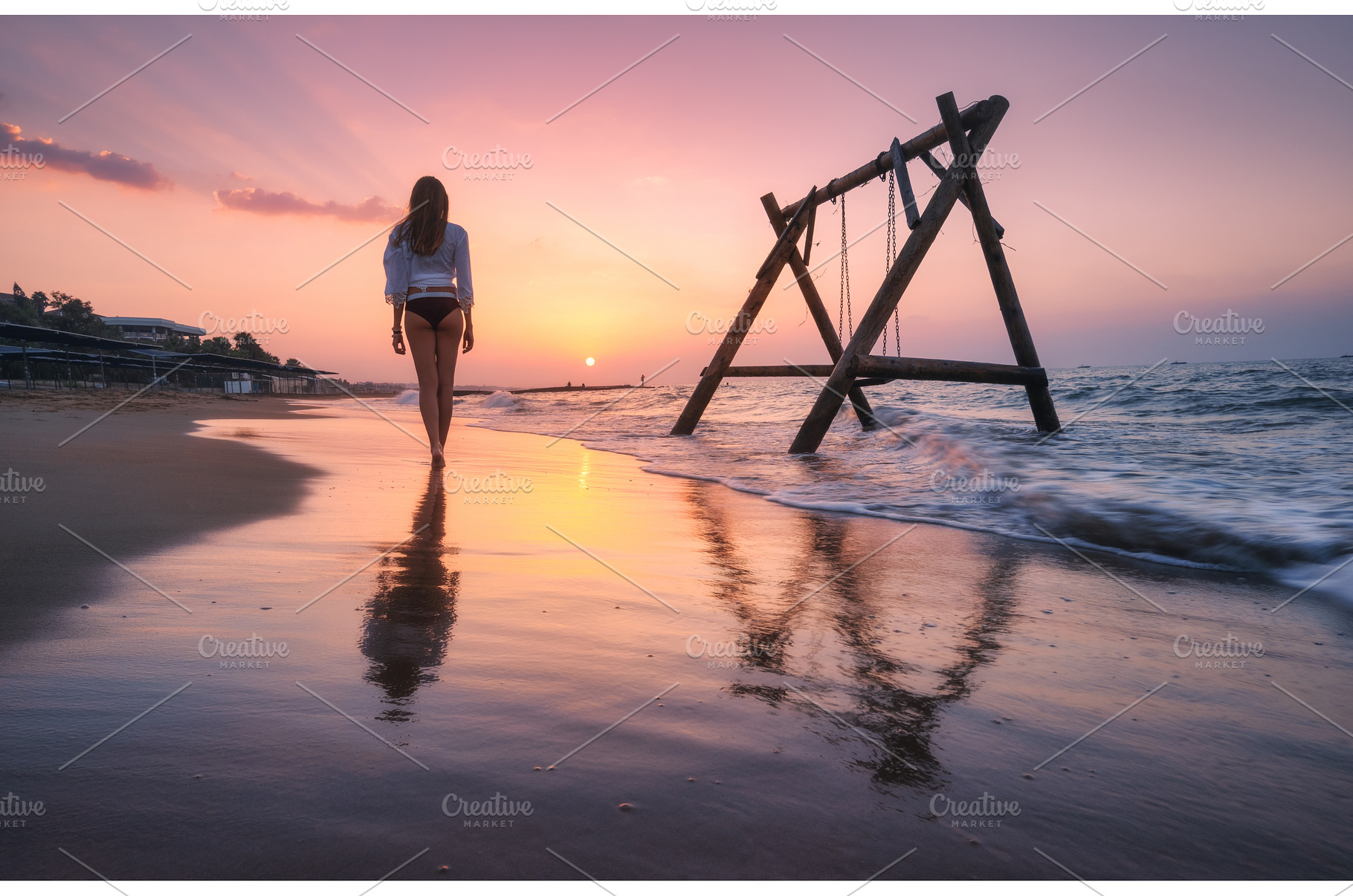 Young woman near wooden swing in, a Person Photo by den-belitsky